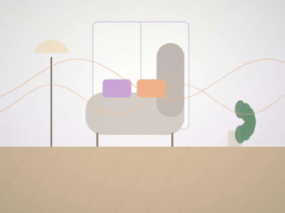 Fauteuil confortable et coussins dans un bureau aux tons doux