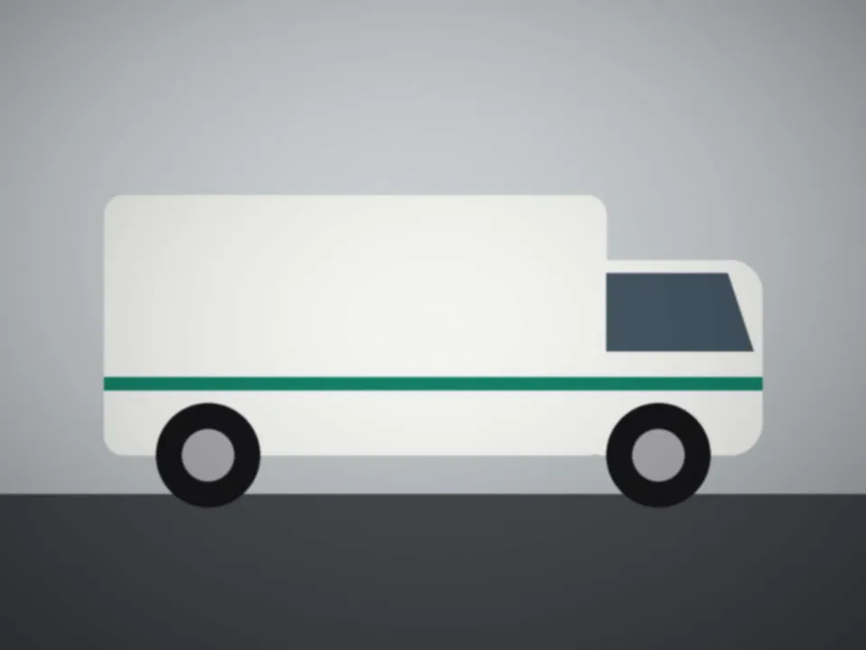 Utilitaire blanc chargé de cartons de déménagement, portes arrière ouvertes