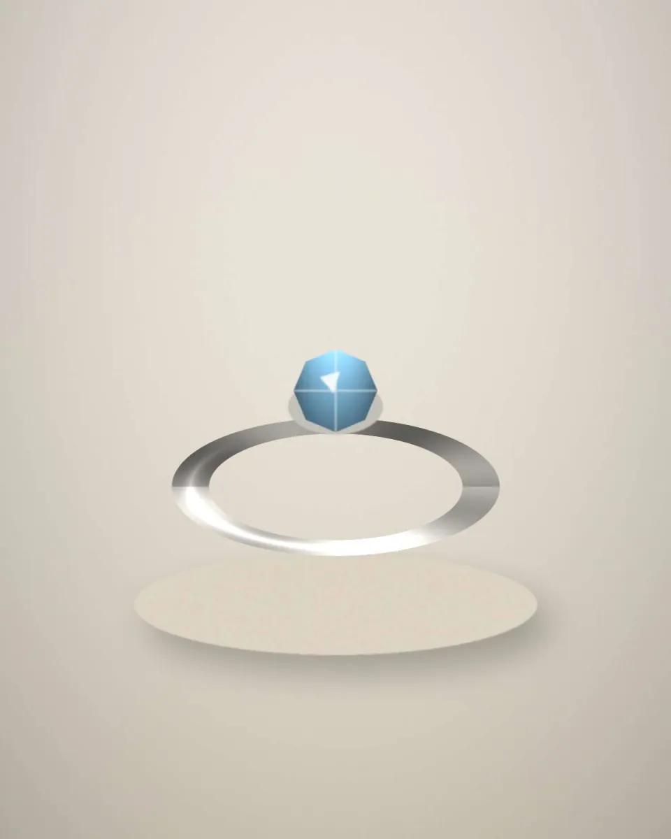 Bague en or blanc avec une topaze bleu ciel