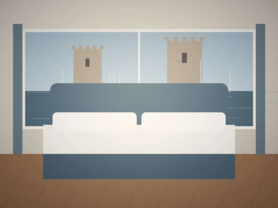 Chambre Vue Port : lit face à la fenêtre et aux tours du Vieux-Port