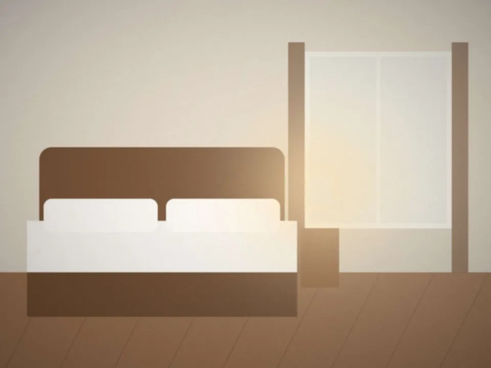 Suite des Armateurs : grand lit, tête de lit en bois, fenêtre lumineuse