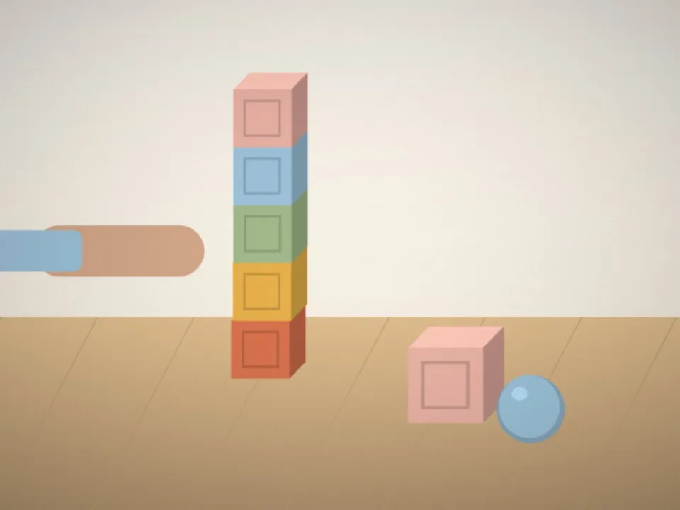 Des cubes et des balles de couleur sur le tapis