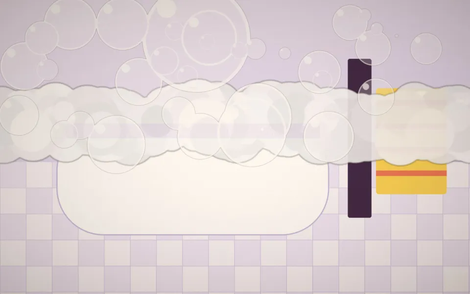 Le salon de toilettage : baignoire surélevée, carrelage clair et serviettes colorées