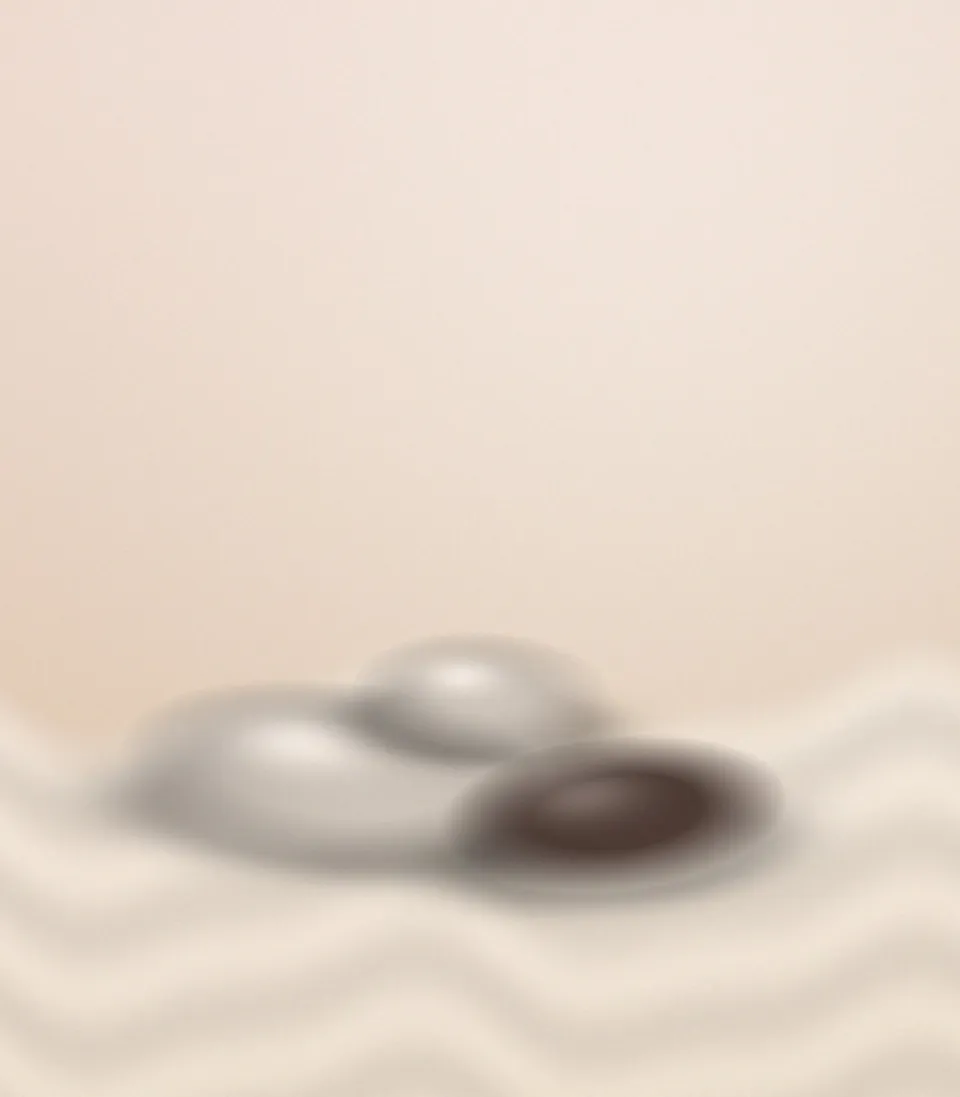 Pierres chaudes posées sur un drap de massage