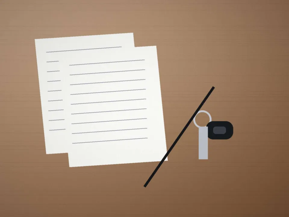 Clé de voiture et fiche d'expertise posées sur le bureau de reprise