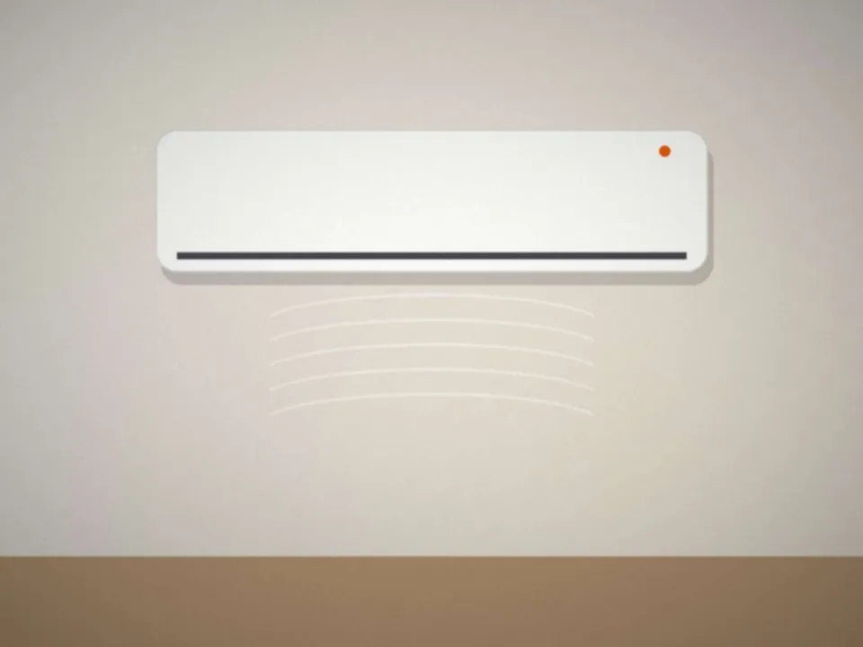 Climatiseur mural réversible installé dans une chambre