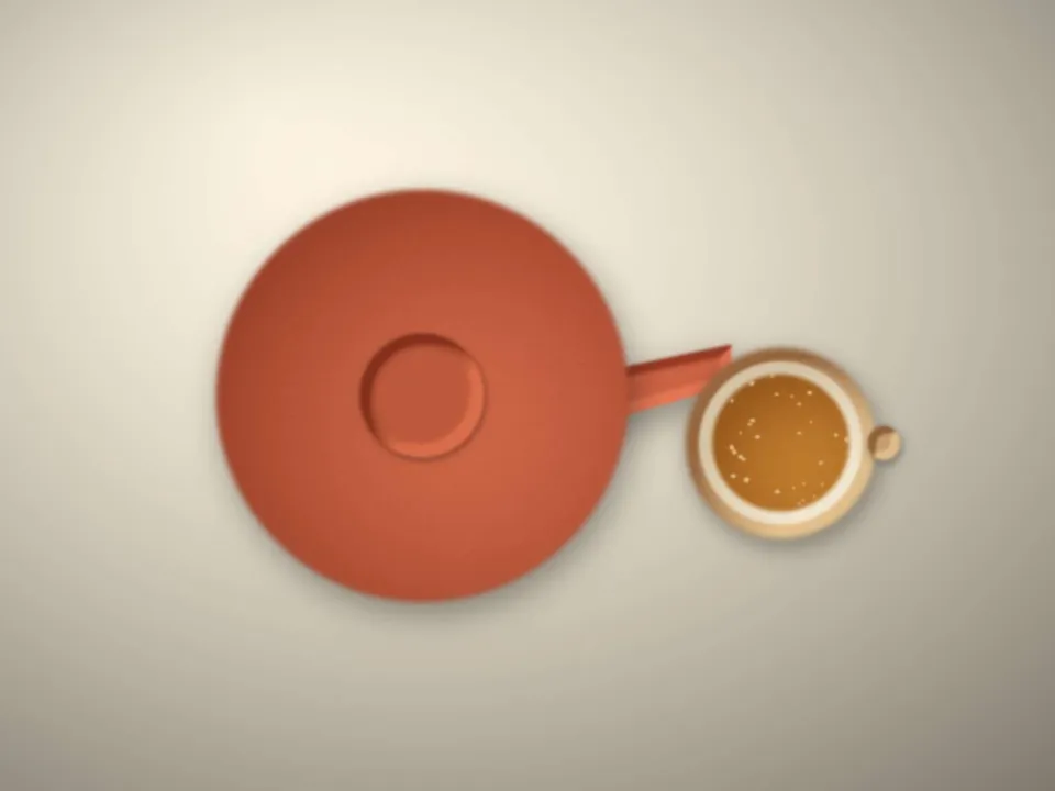Théière et tasse de thé sur une table claire