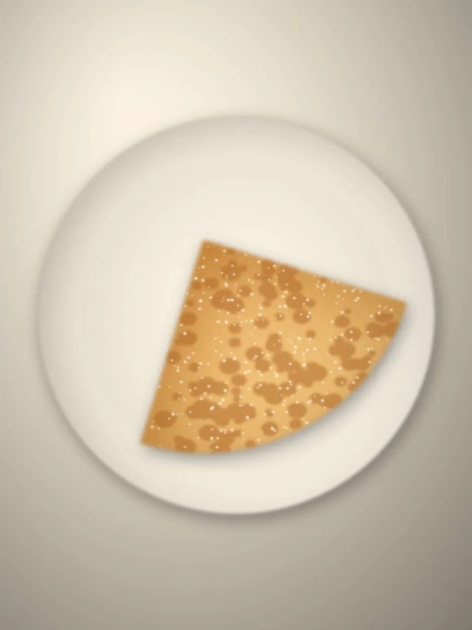 Crêpe au beurre et au sucre pliée en quatre, sur une assiette blanche